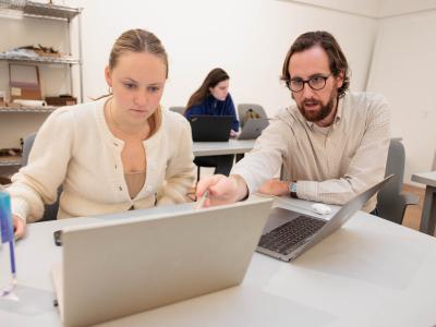 Abbie McGrann, a senior working on her B.F.A. in interior architecture, gets some help from Douglas Crawford.