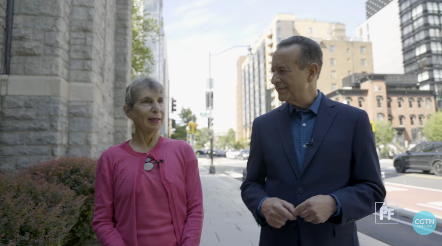 Still of Susan Ariel Aaronson and Mike Walter from CGTN America interview
