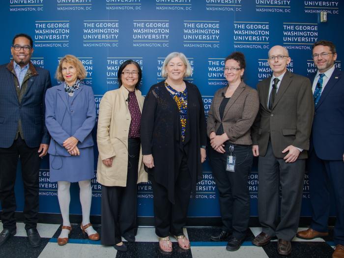 Panelists and moderator pictured with GW's President and Vice Provost